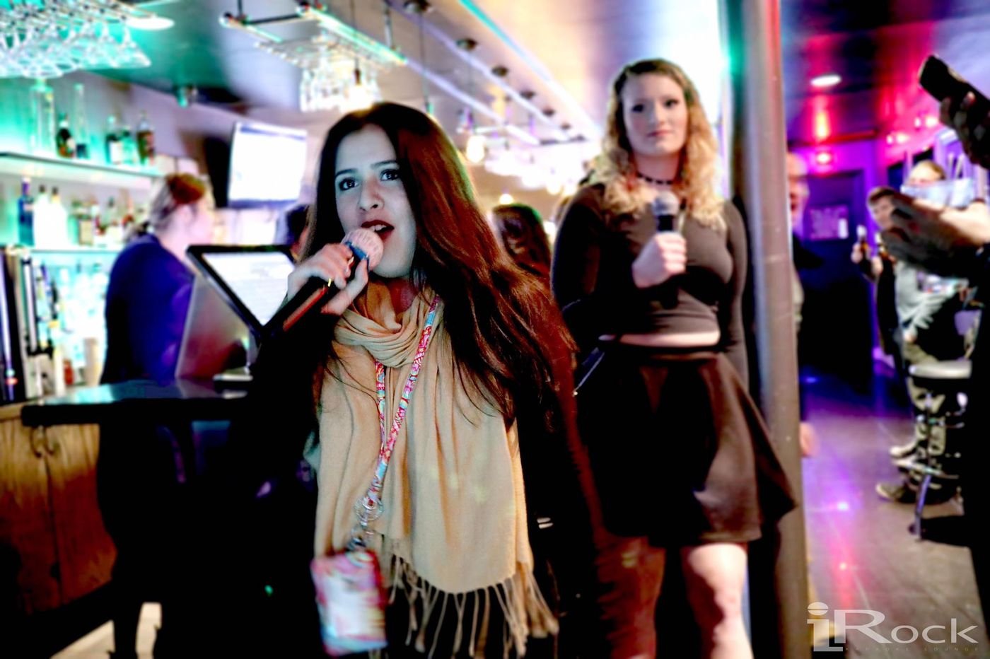 Guests singing karaoke at iRock