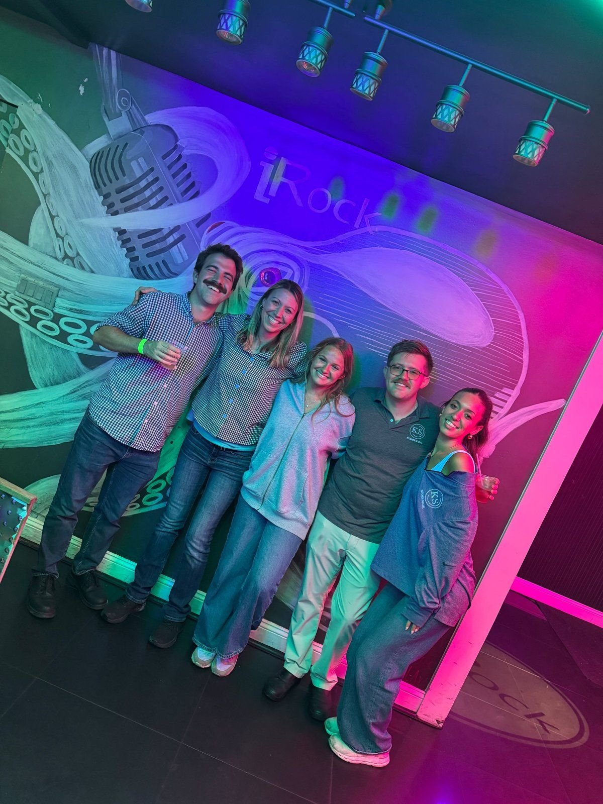 Group photo at the iRock mural wall