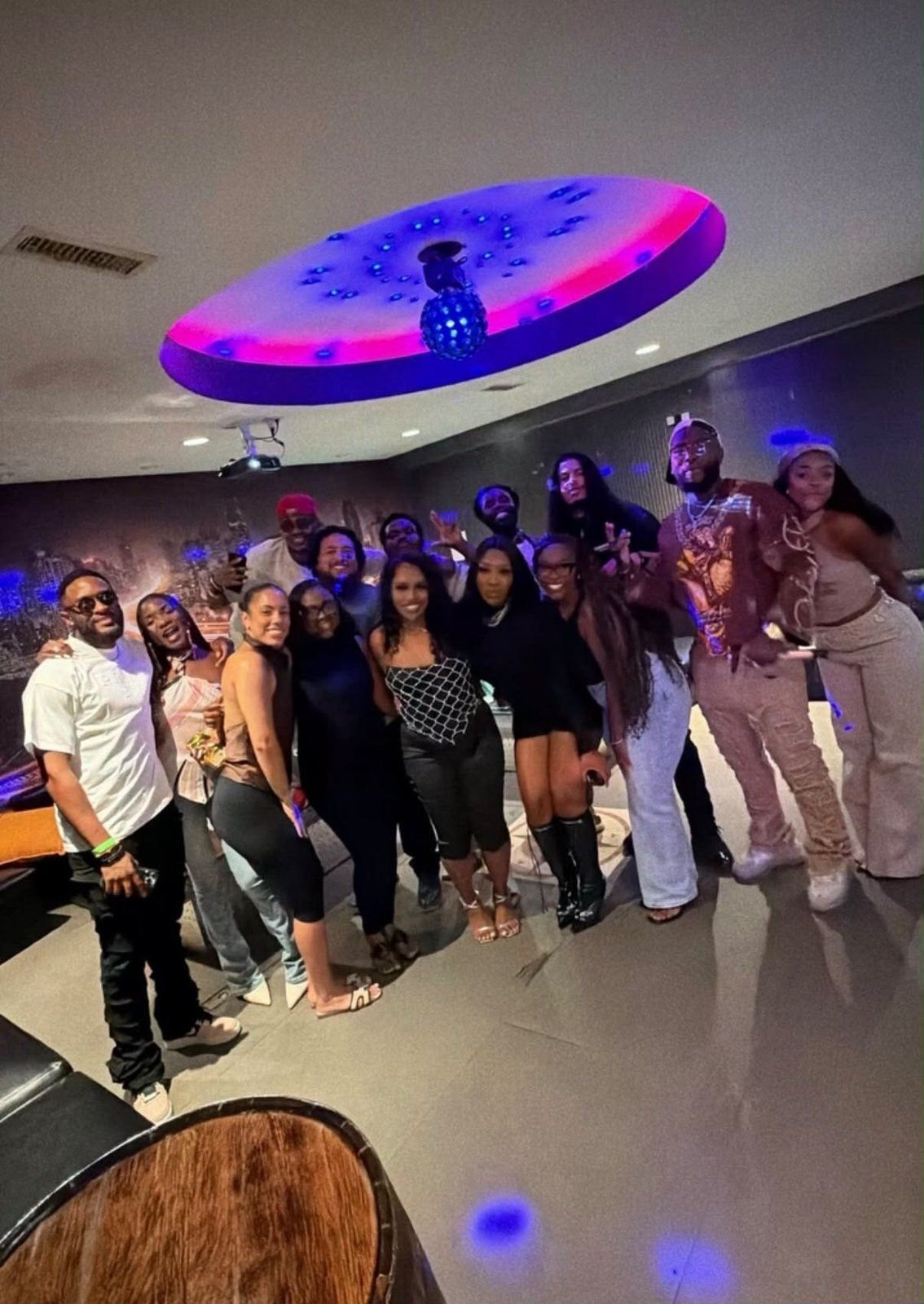Large group celebrating in the VIP room at iRock